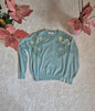 Maglione con decorazioni floreali e perle