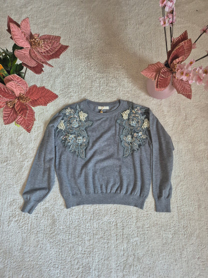 Maglione con decorazioni floreali e perle