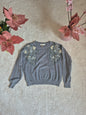 Maglione con decorazioni floreali e perle